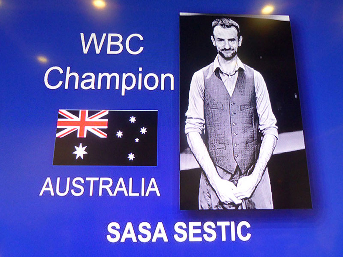 Photo on sign of World Barista Champion, Sasa Sestic from ONA Coffee in Canberra at 2015 World Barista Championships in Seattle.