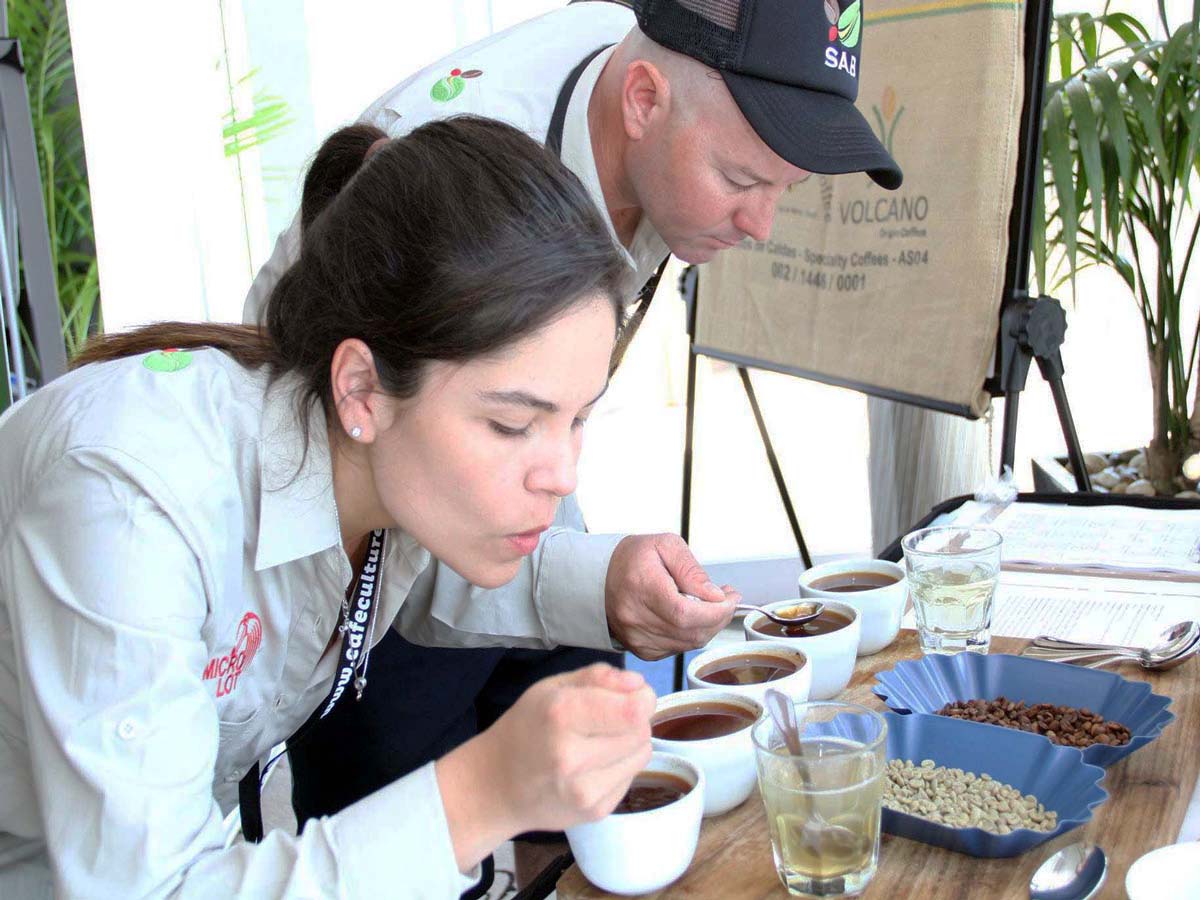 Karen Puryicky and Christian Harvey cupping coffees at South American Bean, their Coomera Warehouse.