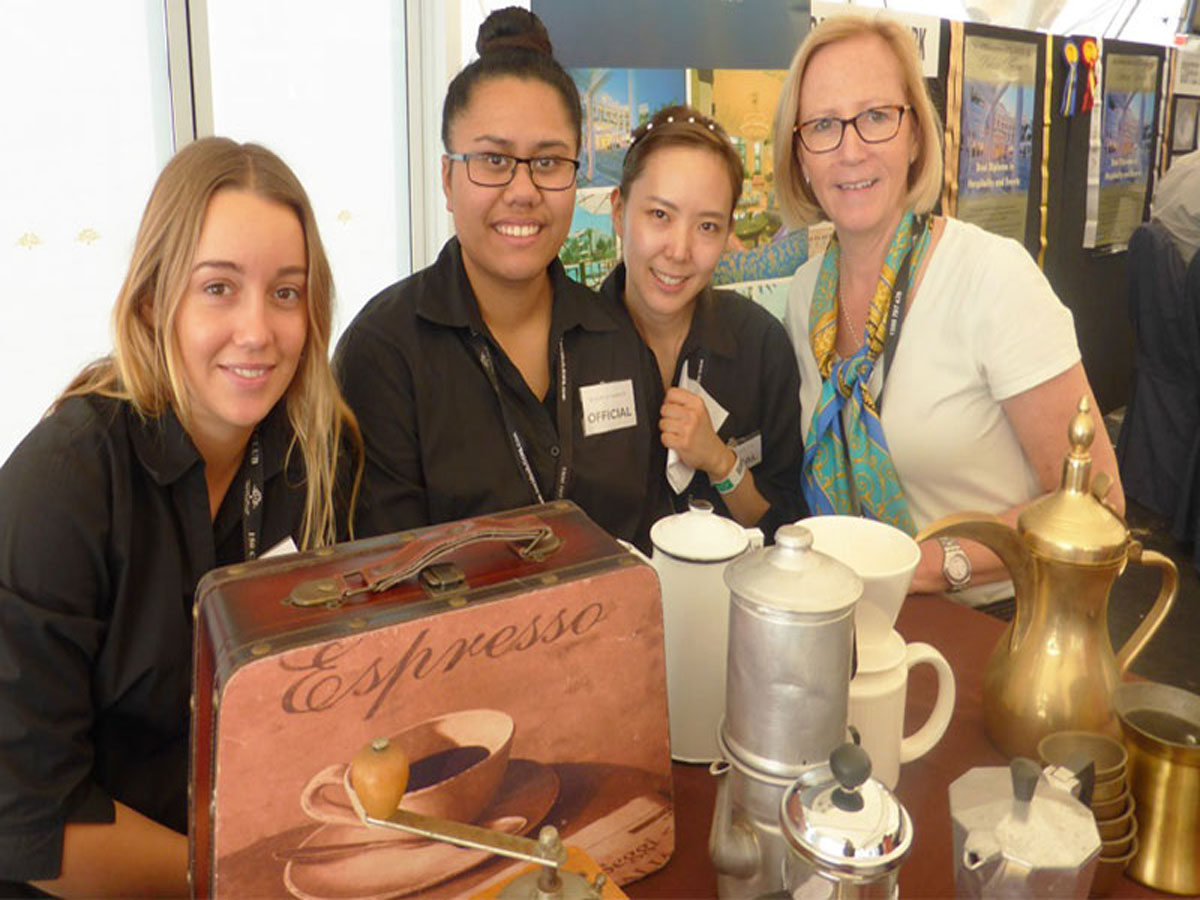 Hospitality trainer Karen Thorburn with students from the International Hotel School from Palazzo Versace at the 2014 Become A Barista competition staged at the Gold Coast Show