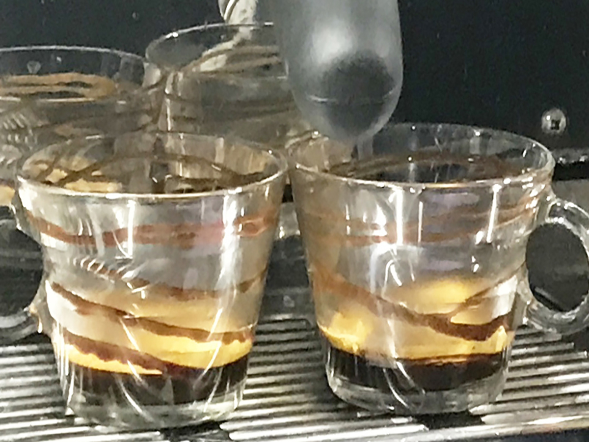 Two Signature beverages with chocolate swirled around the inside of the glass cups at the 2017 Become a Barista competition at Cleanskin Coffee Roasters