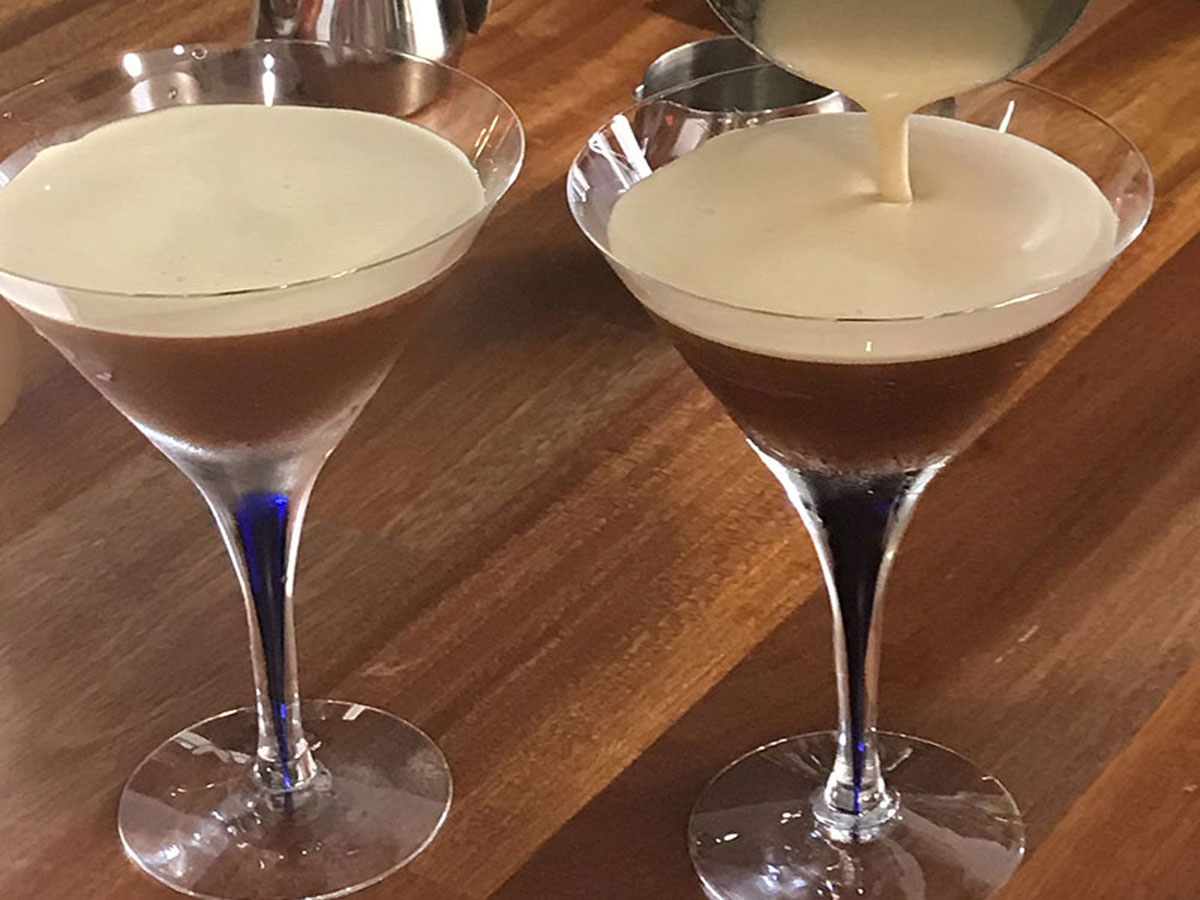 Signature beverages served in martini glasse with cream being poured on top at the 2019 Become A Barista student barista competition at South American Bean, Coomera