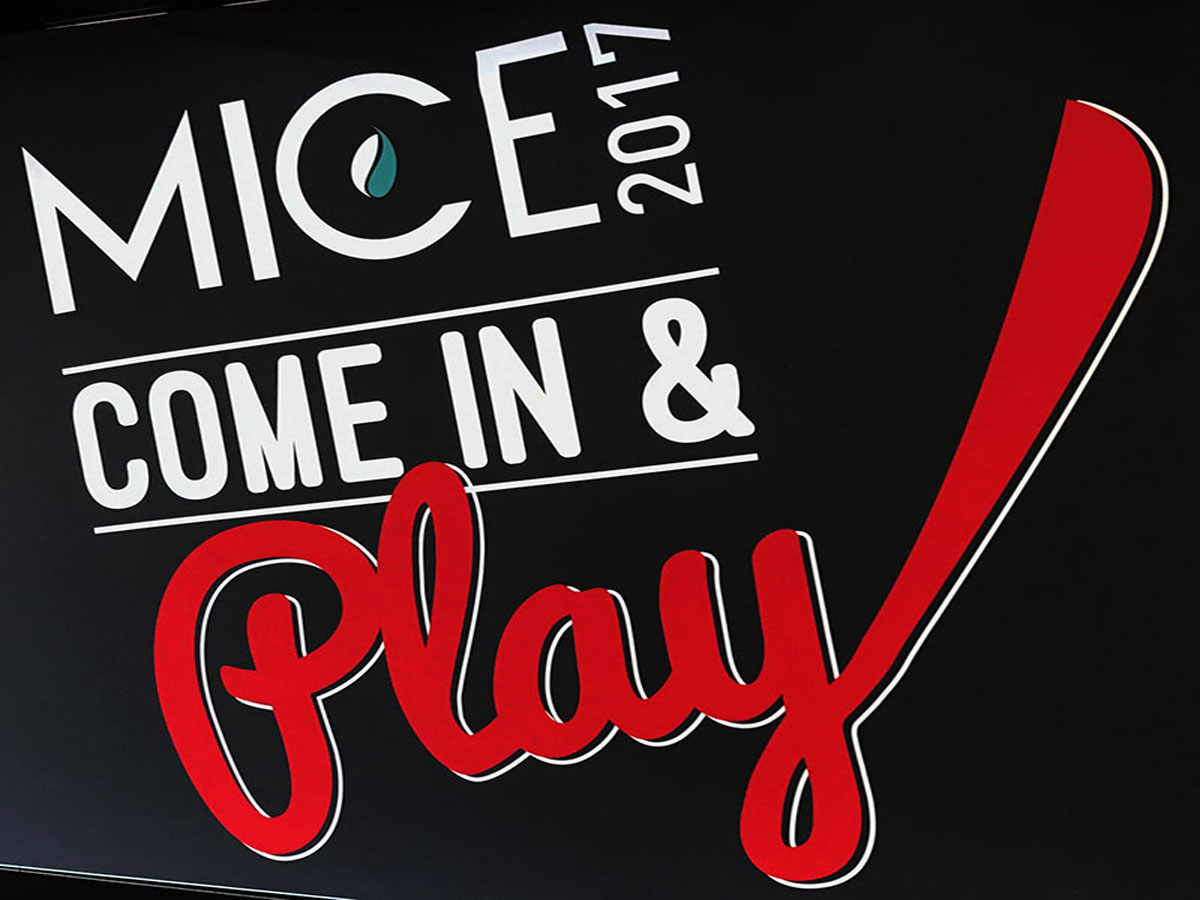 Black white and red sign at Melbourne International Coffee Expo 2017 saying 'MICE 2017 COME IN & PLAY'