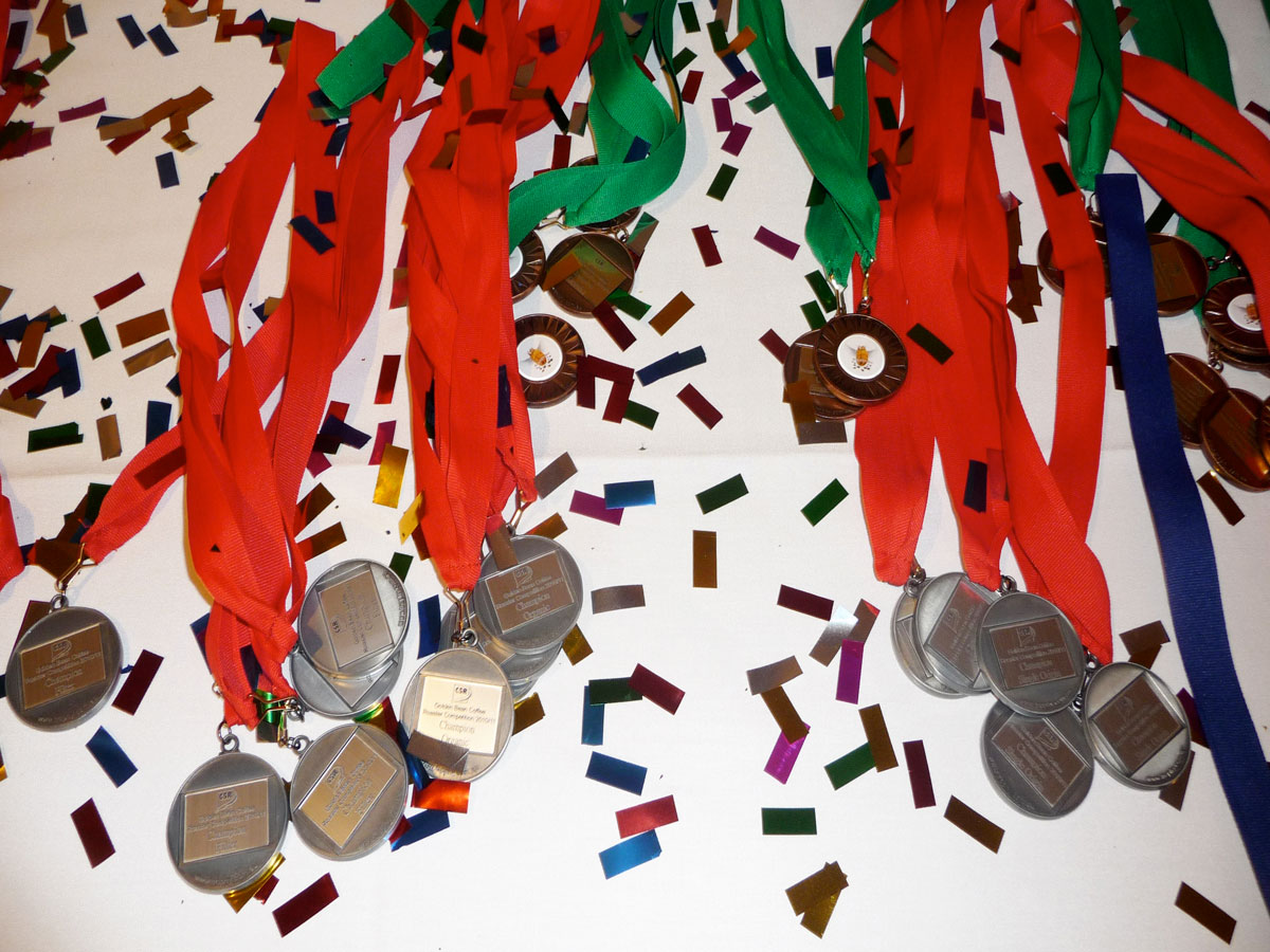 Winning gold, silver and bronze medals with blue, red and green ribbons at the 2010 Golden Bean coffee competition in Port Macquarie