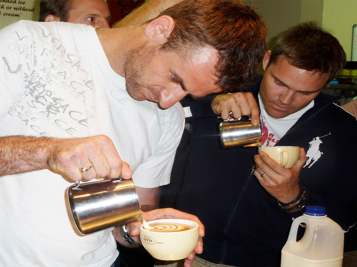 Sasa Sestic and Sam Corra pouring milk onto espressos at 2011 Golden Bean Roasting Competition at Caloundra.