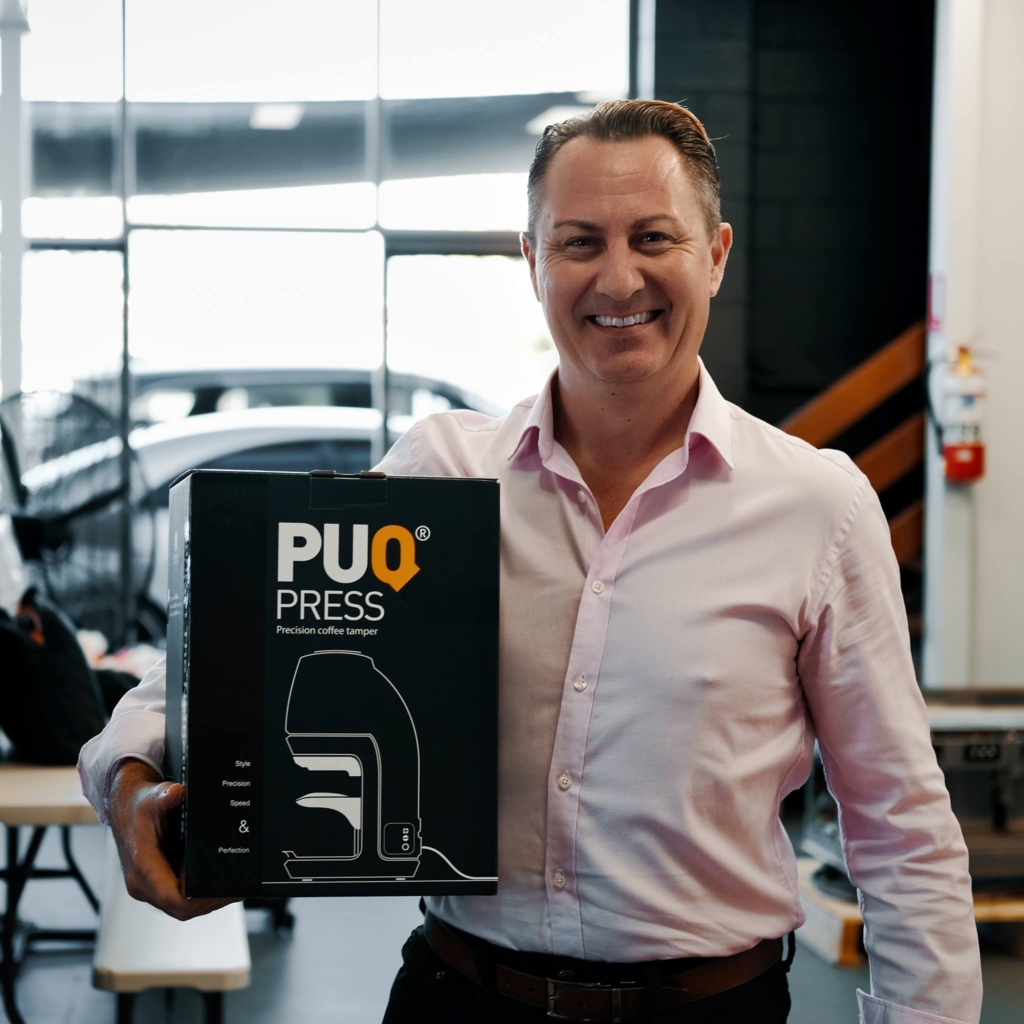 Brett Bollwell with a Puqpress in a box. He brought automated tamping to Australia from the Netherlands where it originated.