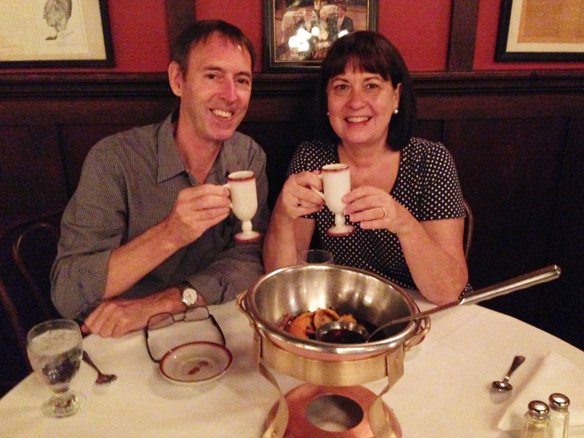 Christine Cottrell and Paul Holiday drinking Cafe Brulot at Antoines Restaurant in New Orleans